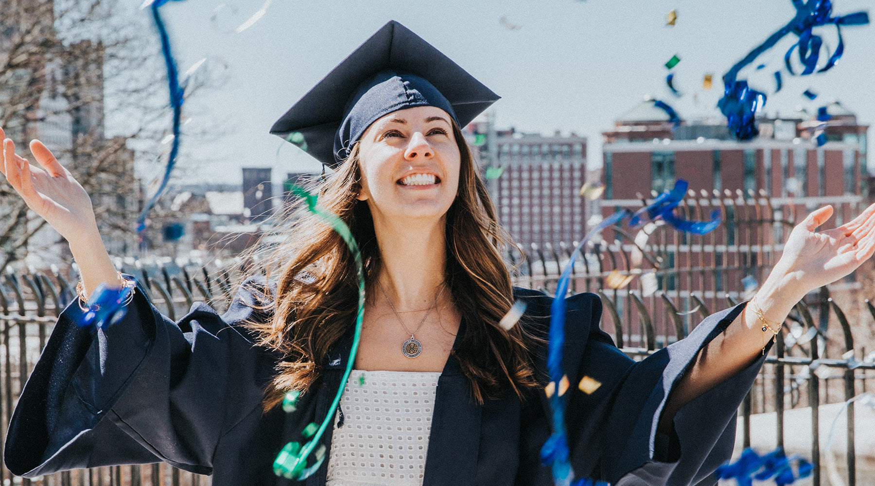young woman graduating wearing cap and gown