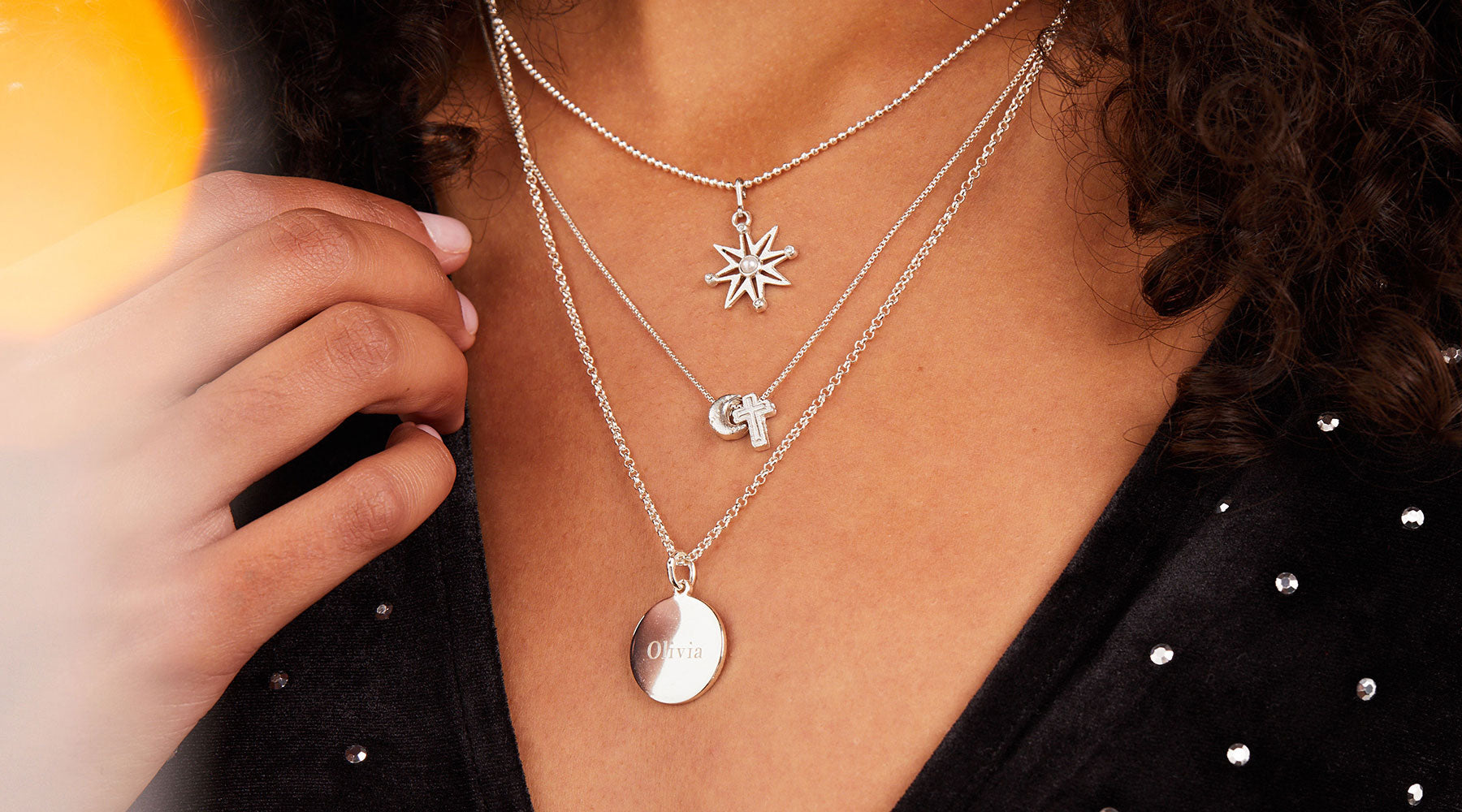 model wearing layered ALEX AND ANI necklaces