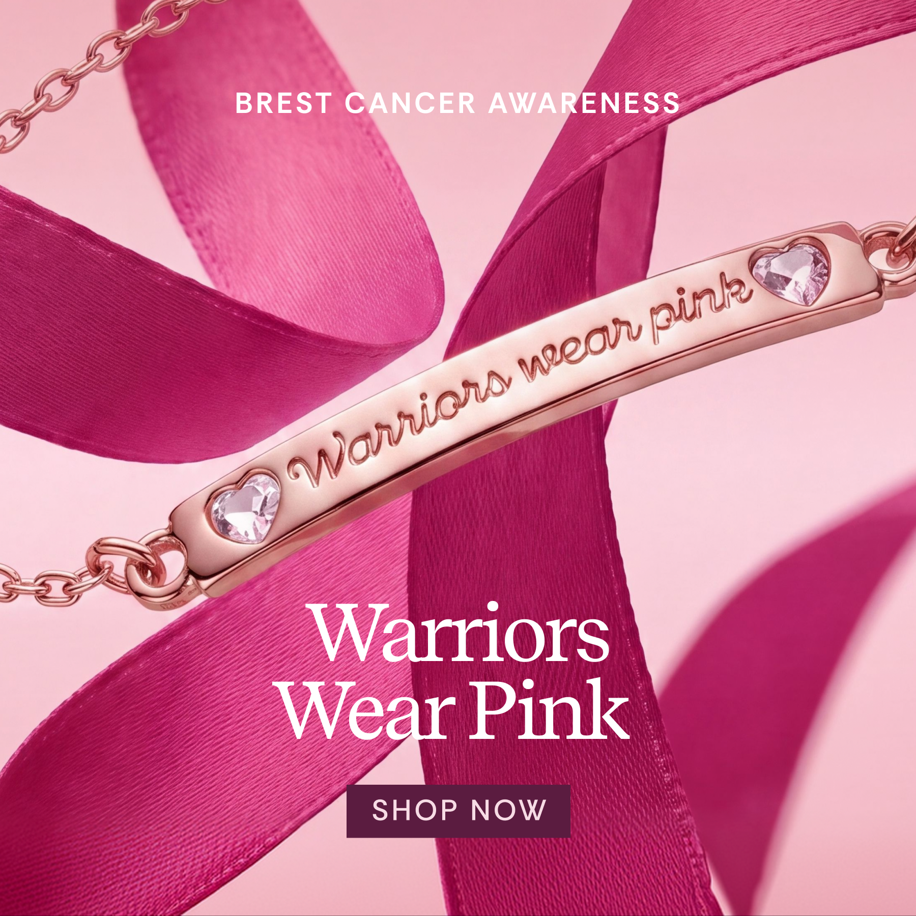 A rose gold breast cancer awareness bar necklace with the words 'Warriors wear pink' and heart-shaped clear stones, draped over bright pink ribbons on a pink background with 'BREST CANCER AWARENESS' and 'Warriors Wear Pink' text.