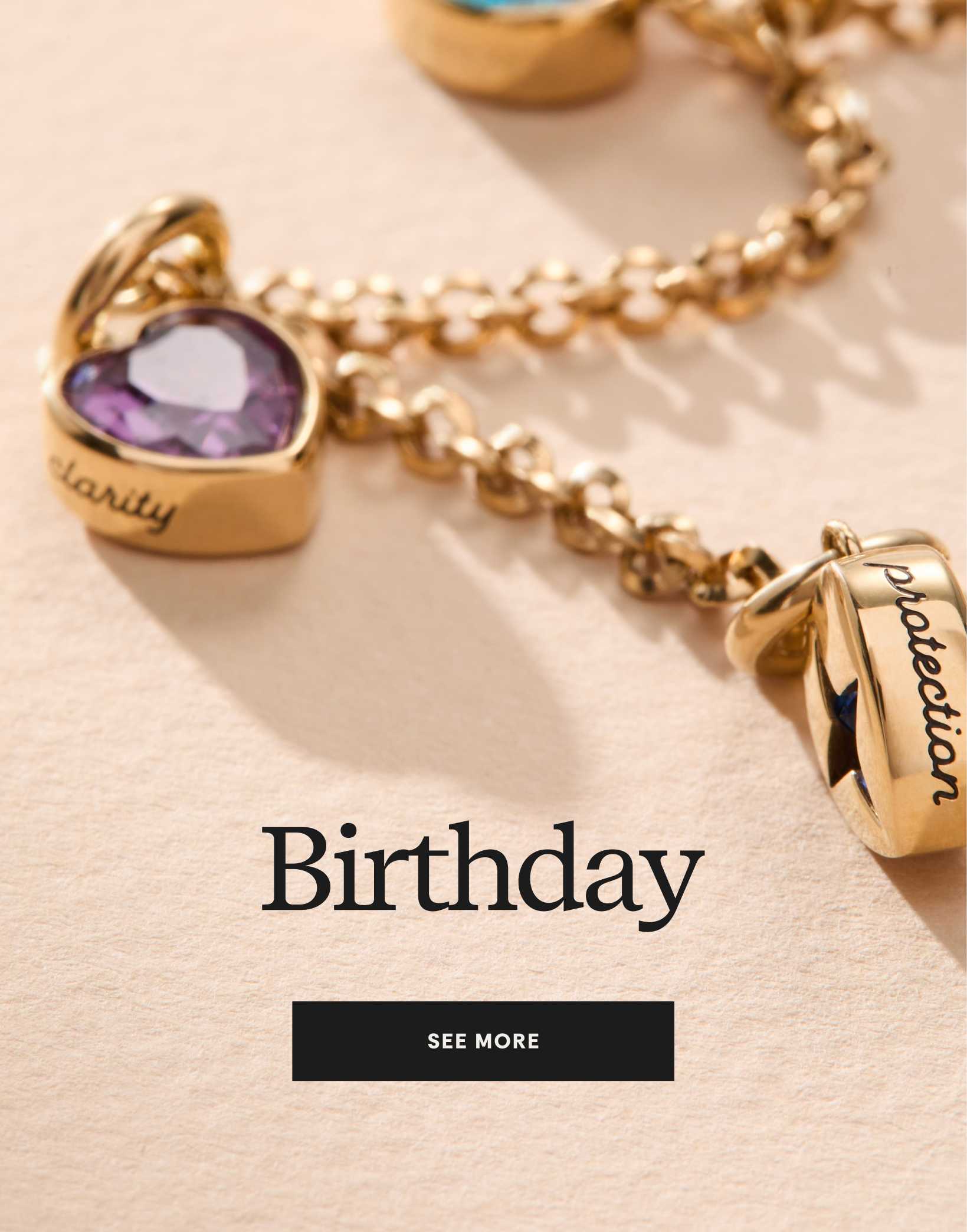 Gold bracelet with heart-shaped charms on a beige background, labeled 'Birthday'.