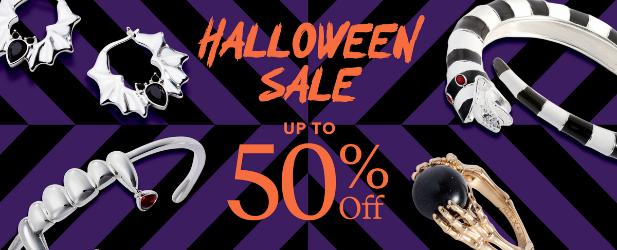 Halloween sale promotional banner with silver and gold gothic jewelry on a purple and black striped background, featuring text that reads 'HALLOWEEN SALE UP TO 50% Off'.