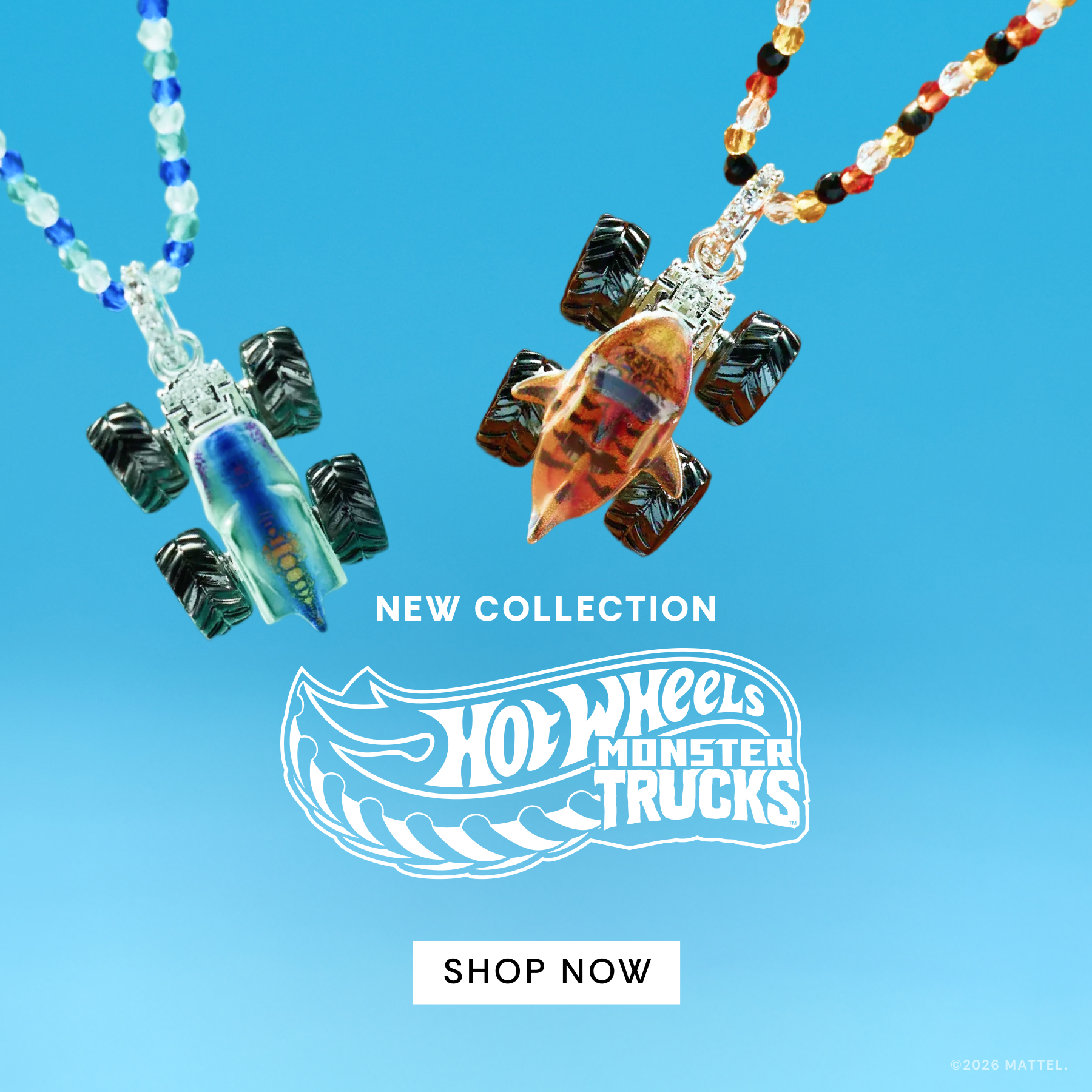 Necklaces with tiger and shark and monster truck designs on a blue background with Hot Wheels Monster Trucks branding.