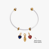 White bracelet with gold and red heart-shaped charms on a white background