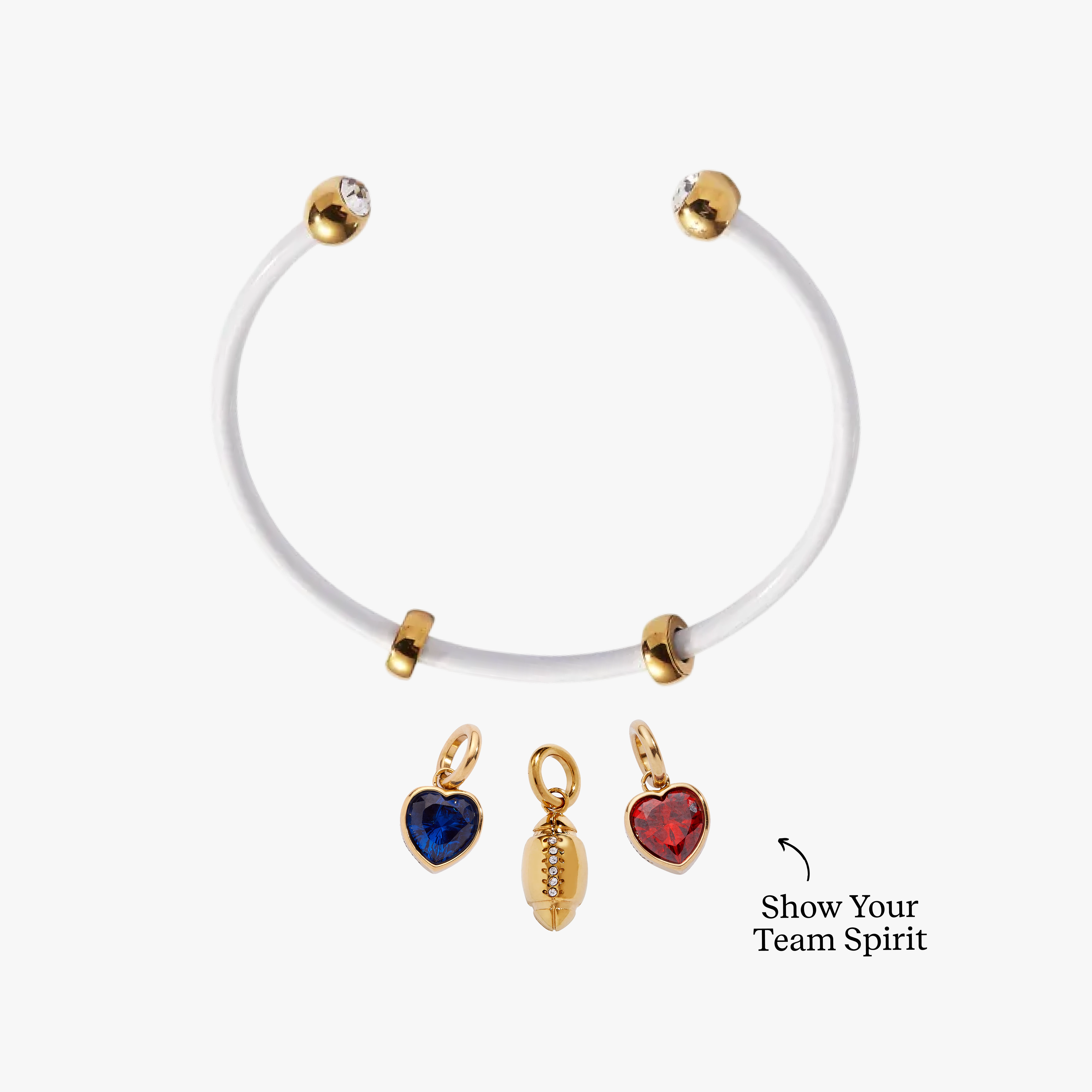White bracelet with gold and red heart-shaped charms on a white background