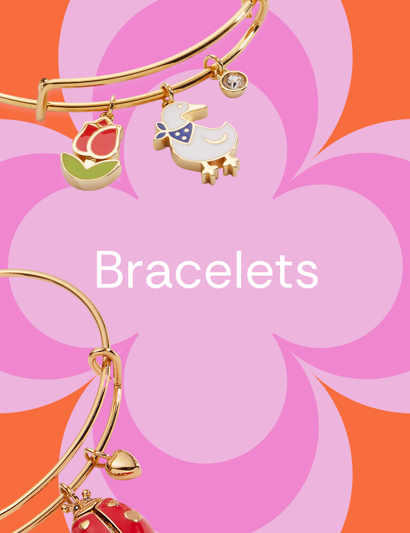 Gold bracelets with charms on a pink and orange floral background