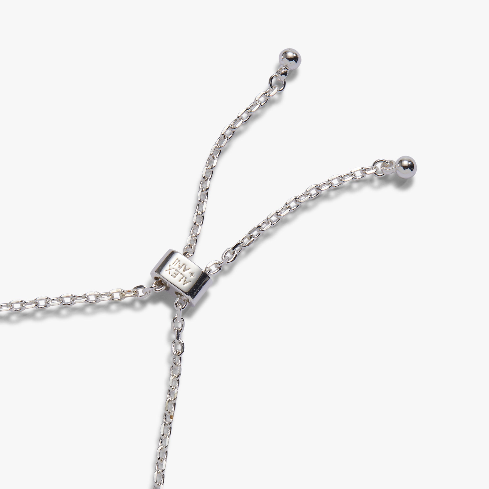Close-up of a silver Y-shaped chain necklace with a rectangular sliding clasp and small bead ends, photographed on a clean white background.