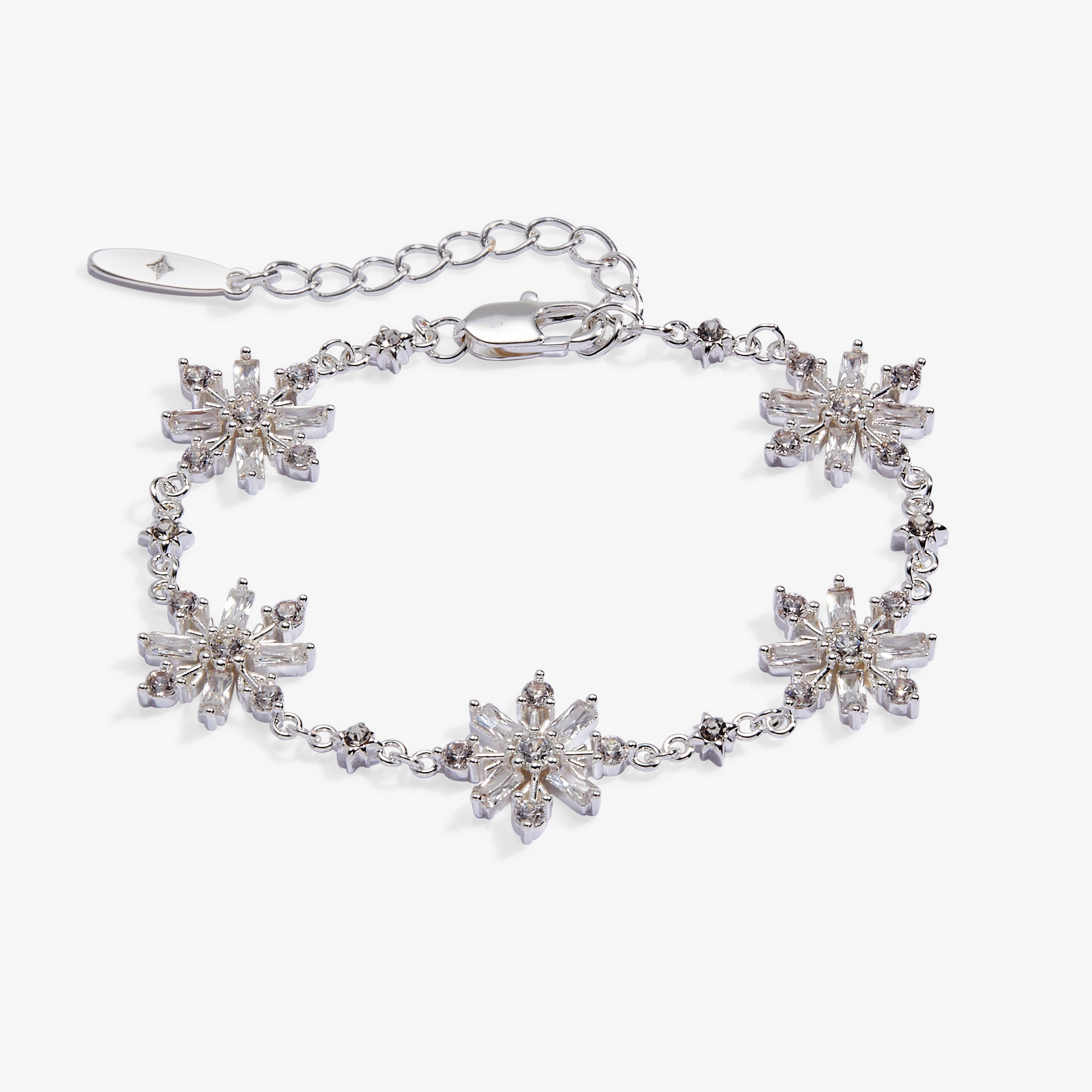 A silver-toned bracelet featuring five snowflake-shaped crystal clusters, a matching extender chain, and a lobster clasp, displayed on a clean white background.