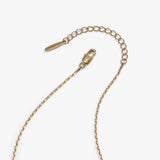A gold-toned metal chain extender with a lobster clasp and a small branded tag, photographed on a clean white background.