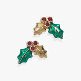 A pair of gold-tone holly leaf stud earrings with vibrant green enamel leaves and three small round pink gemstones at the top, set against a clean white background.