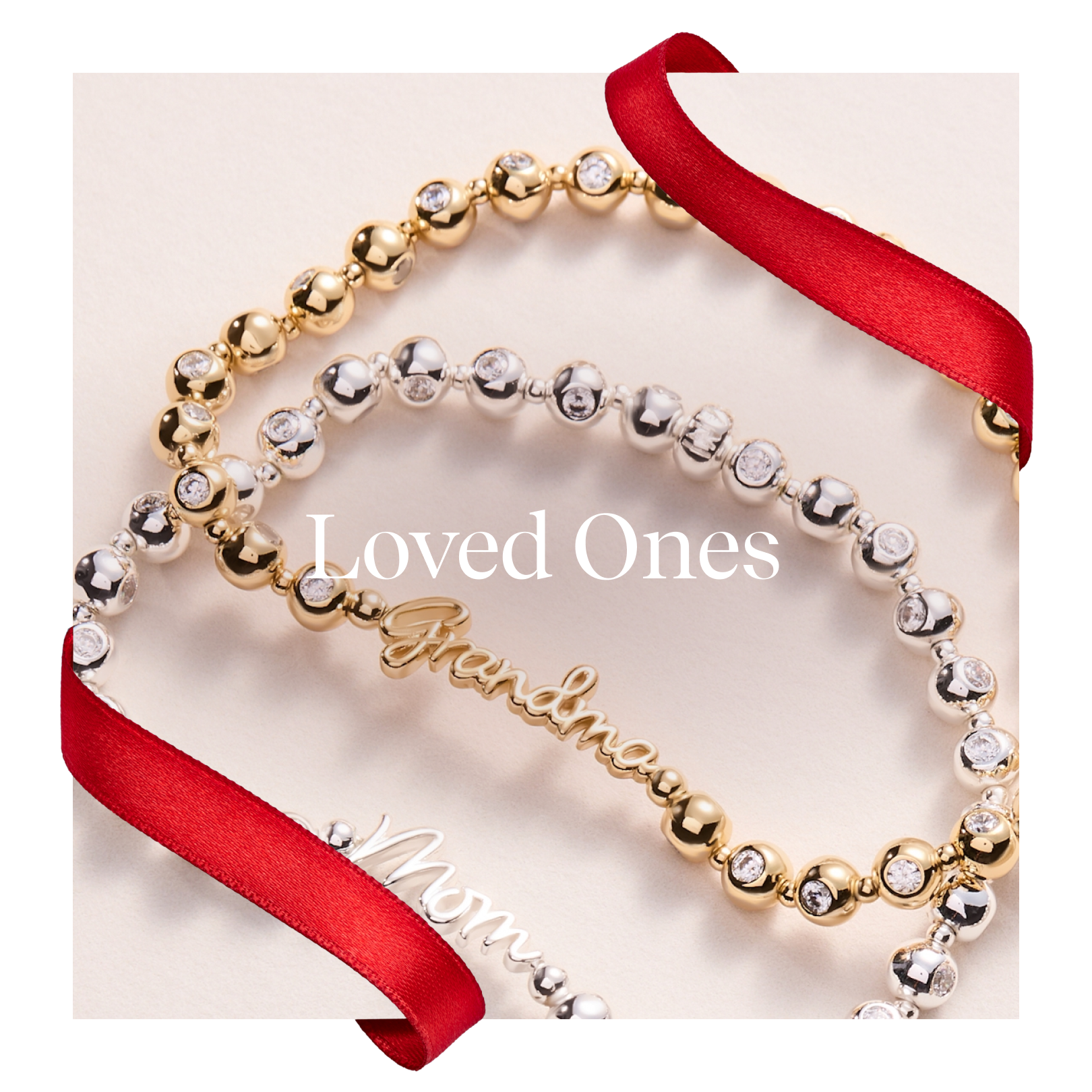 Two beaded bracelets with engraved names on a white background with red ribbons.