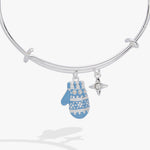 A silver bangle bracelet with a dangling blue and white patterned mitten charm and a small silver star charm, shown on a light gray background.