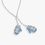 A silver Y-shaped chain necklace featuring two small mitten-shaped charms in light blue with white snowflake patterns and silver accents, shown on a light gray background.