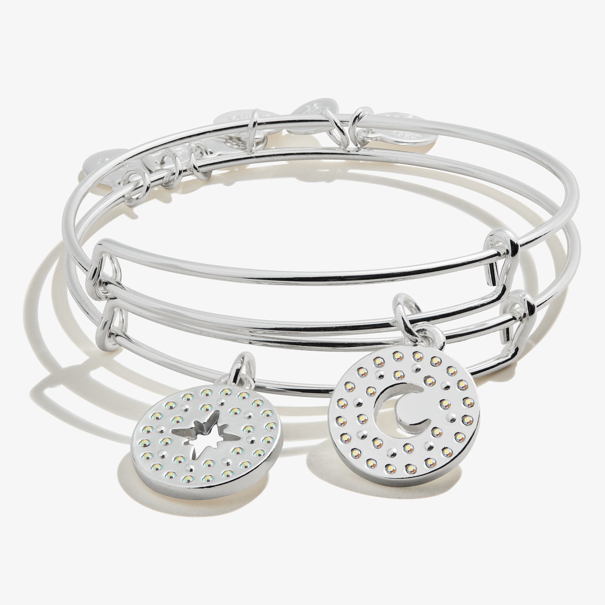 Two silver bangle bracelets with charms